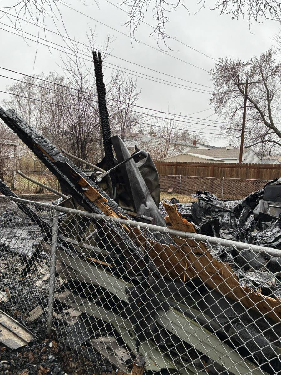 Burned garage contents in the debris field, including equipment and framing members